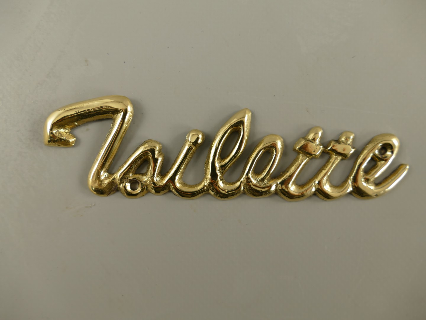 Schild Toilette Messing L.13cm P/St. Schild Toilette Messing L.13cm P/St.